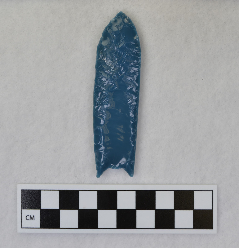 A fluted point created by Donald E. Crabtree from light blue glass as part of his fluting experiements. Associated with objects Ce.1015, Ce.1017, Ce.1019, Ce.1020.