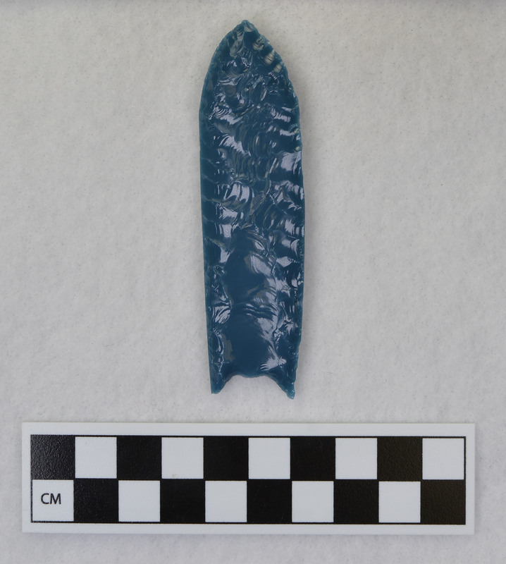 A fluted point created by Donald E. Crabtree from light blue glass as part of his fluting experiements. Associated with objects Ce.1015, Ce.1017, Ce.1019, Ce.1020.