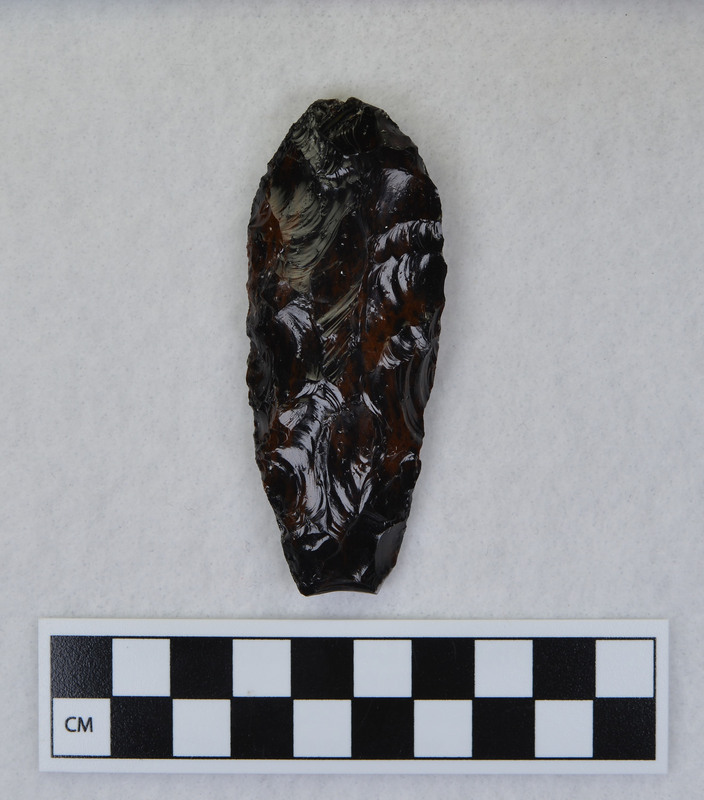A Clovis point created by Donald E. Crabtree made during his Clovis fluting experiments. The channel flake from this object is Ce.1033.