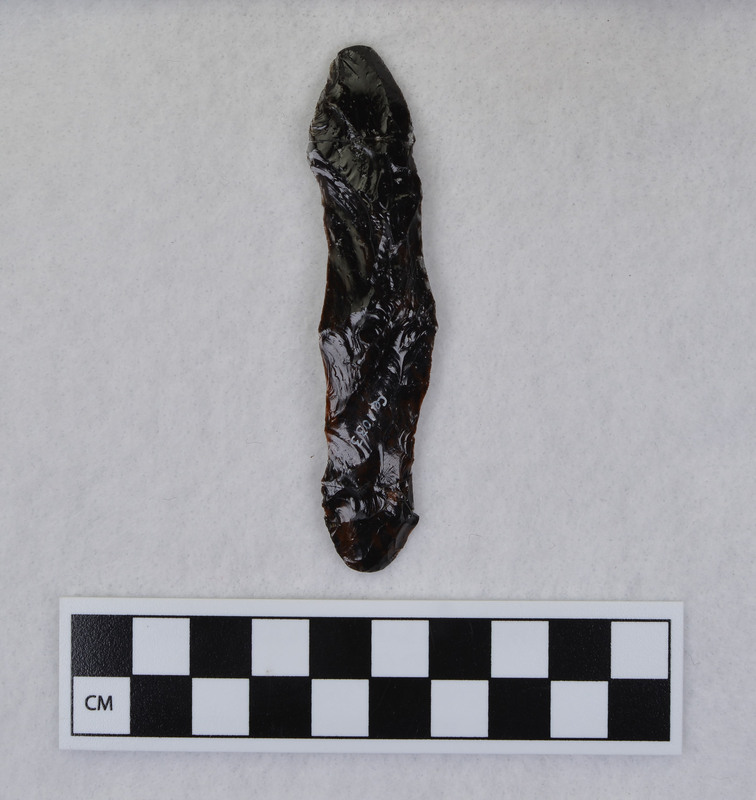 A channel flake created by Donald E. Crabtree made during his Clovis fluting experiments. This channel flake mends with Ce.1032m the Clovis point from which it was removed.