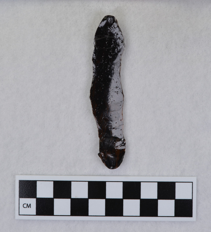 A channel flake created by Donald E. Crabtree made during his Clovis fluting experiments. This channel flake mends with Ce.1032m the Clovis point from which it was removed.