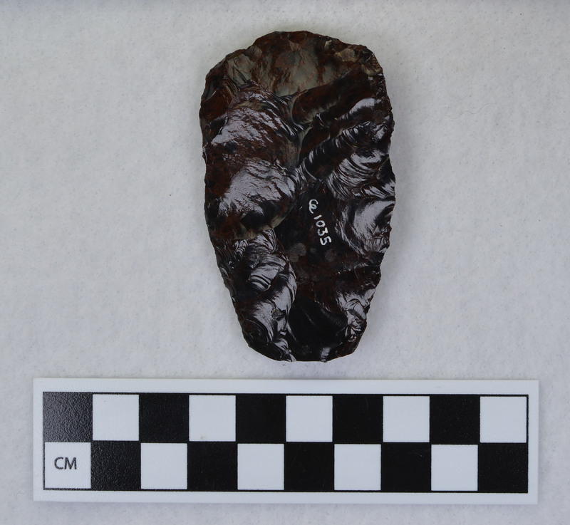 Channel flake removed, mends w/Ce.1036, Distal end ground and supported on anvil. (JW)