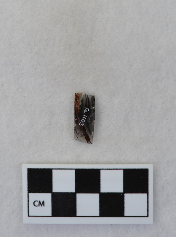 This item was created by Donald E. Crabtree during his fluting experiments. The fluted point that this flake was detached is Ce.1101. Ce.1101 was fluted using rock anvil to support tip and hammerstone was used to remove channel flake. Gene Titmus noted that the distal end ground and the platform were ground.