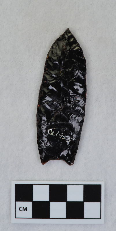 Fluted, channel flake removed by pressure. Point probably slipped in vise causing channel flake to dive almost severing the tip. (JW)