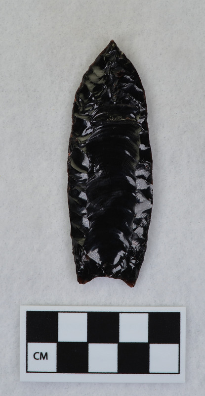 Fluted, channel flake removed by pressure. Point probably slipped in vise causing channel flake to dive almost severing the tip. (JW)