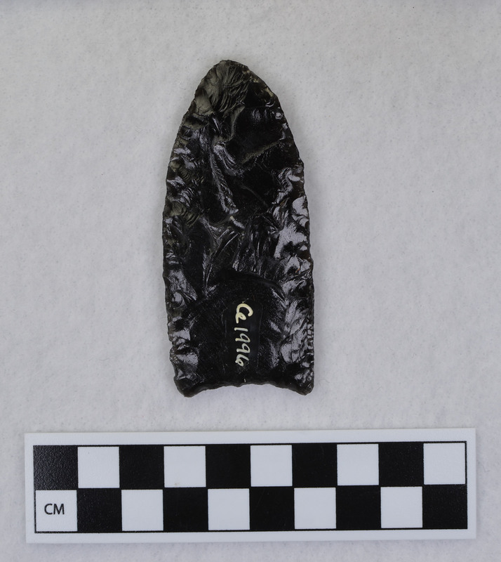 This object may have been created by Donald E. Crabtree, but there is not enough evidence to confirm this. This object has been fluted, one face (side) has been worked with all percussion. The fluted margins are unground. (JW)