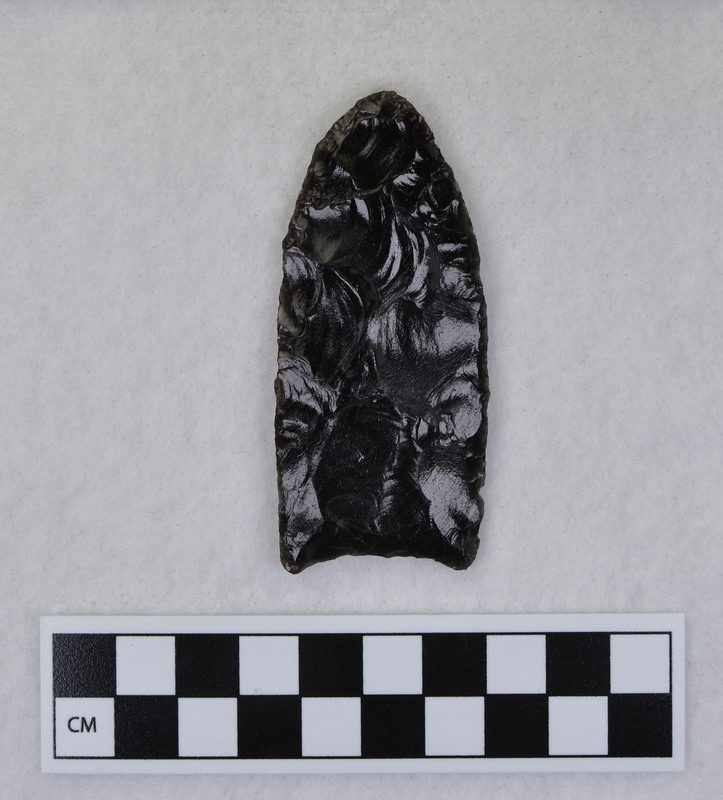 This object may have been created by Donald E. Crabtree, but there is not enough evidence to confirm this. This object has been fluted, one face (side) has been worked with all percussion. The fluted margins are unground. (JW)