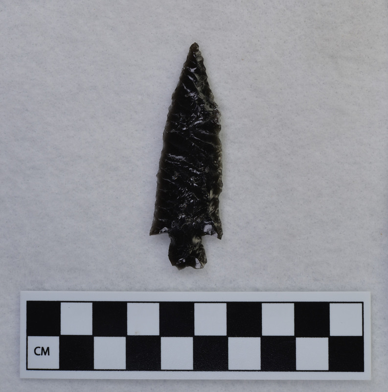 Stemmed, parallel diagonal flaking, With phenocryst left in one edge. (GT)