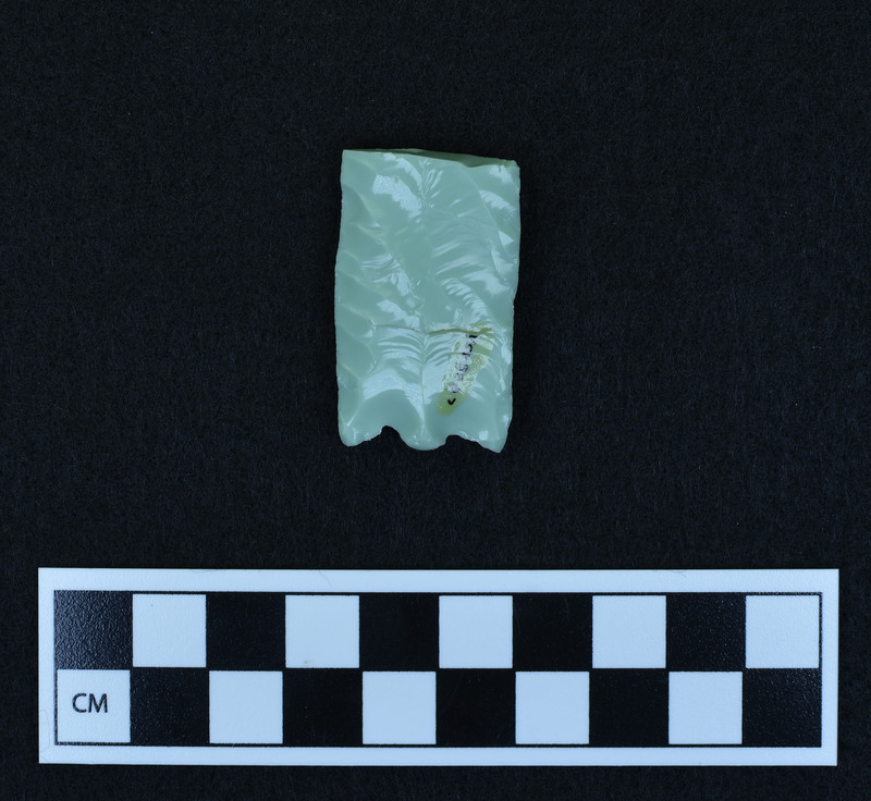 Preform for fluted point, broken. Ce.3625A - proximal end. Good example of platform prepared for channel flake removal. Broken in half by bending from margin. Possibilities: a.)broken by too much pressure from use, b.) platform too heavy and shock severed point, c