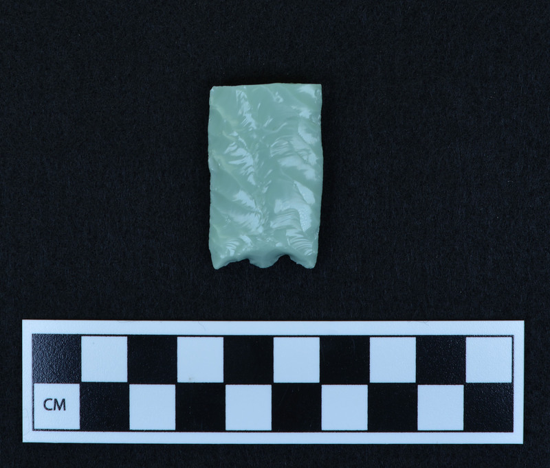 Preform for fluted point, broken. Ce.3625A - proximal end. Good example of platform prepared for channel flake removal. Broken in half by bending from margin. Possibilities: a.)broken by too much pressure from use, b.) platform too heavy and shock severed point, c
