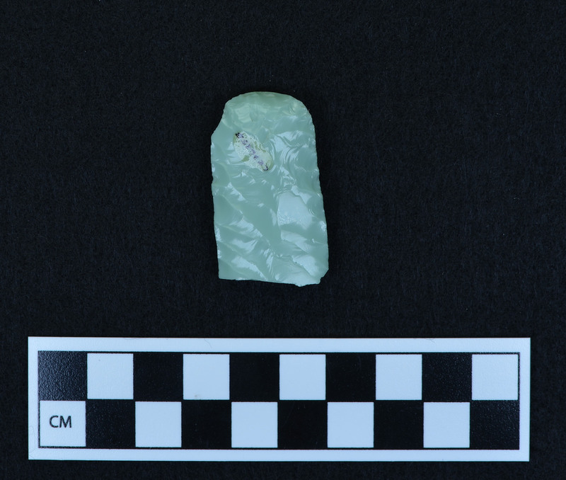 Preform for fluted point, broken. Ce.3625A - proximal end. Good example of platform prepared for channel flake removal. Broken in half by bending from margin. Possibilities: a.)broken by too much pressure from use, b.) platform too heavy and shock severed point, c