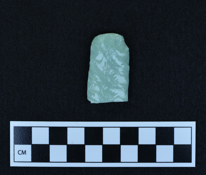 Preform for fluted point, broken. Ce.3625A - proximal end. Good example of platform prepared for channel flake removal. Broken in half by bending from margin. Possibilities: a.)broken by too much pressure from use, b.) platform too heavy and shock severed point, c