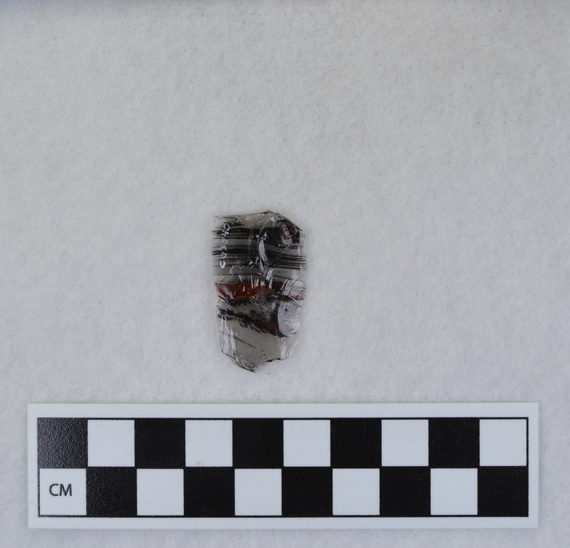Channel, fragment, mends w/Ce.956. Ce.3840 - Ce.3844: presumed to be channel flakes from unlabeled side, but I could not get them to fit. Ce.3841 and Ce.3842 were taped together, as were flake fragments from other side. Ce.3843 and Ce.3844 found loose in bag. Ce.3835 - Ce.3844 in one b