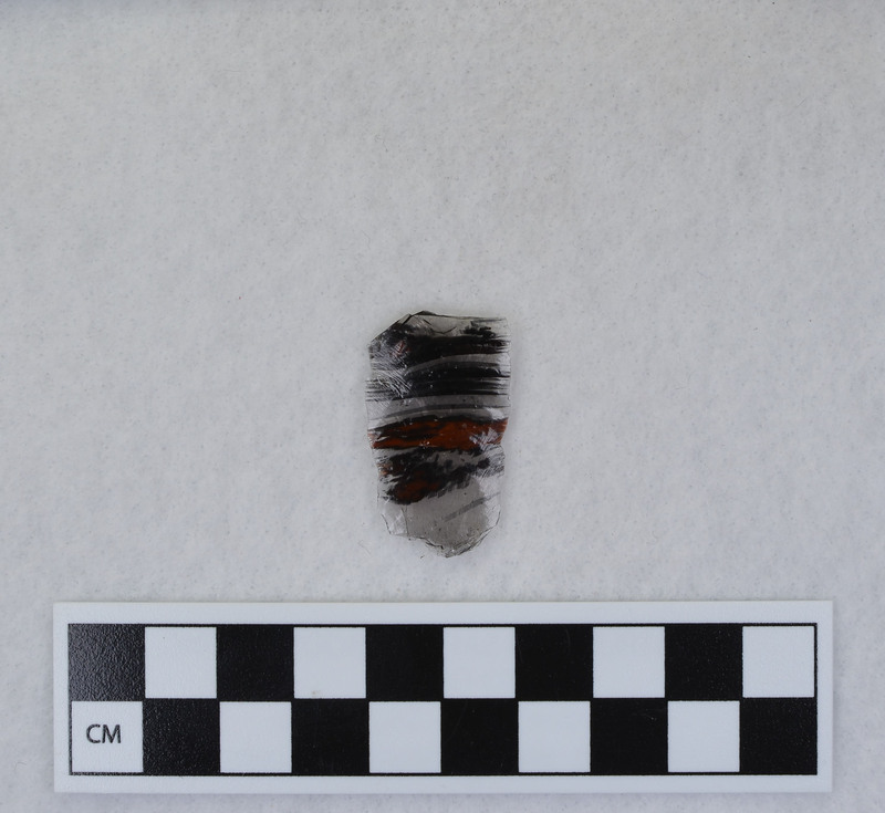 Channel, fragment, mends w/Ce.956. Ce.3840 - Ce.3844: presumed to be channel flakes from unlabeled side, but I could not get them to fit. Ce.3841 and Ce.3842 were taped together, as were flake fragments from other side. Ce.3843 and Ce.3844 found loose in bag. Ce.3835 - Ce.3844 in one b