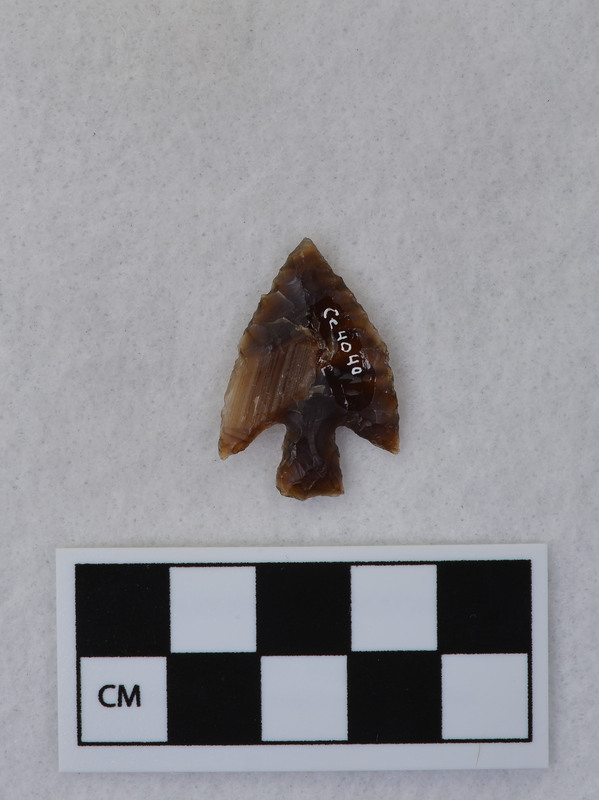 This object is a stemmed point made by Donald E. Crabtree. It is noted that this piece was made early in Crabtree's experiments.