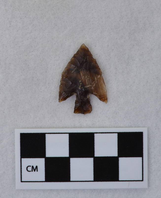 This object is a stemmed point made by Donald E. Crabtree. It is noted that this piece was made early in Crabtree's experiments.