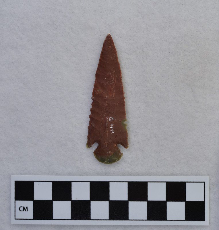 A biface made by Donald E. Crabtree early in his experiments with flintknapping. This corner notched point was made from jasper.