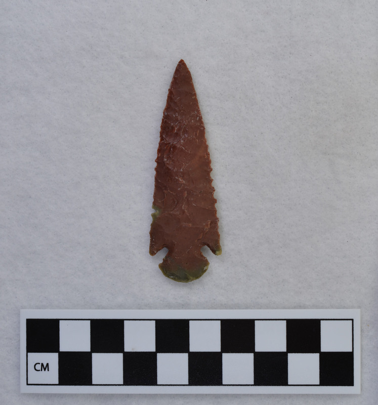 A biface made by Donald E. Crabtree early in his experiments with flintknapping. This corner notched point was made from jasper.