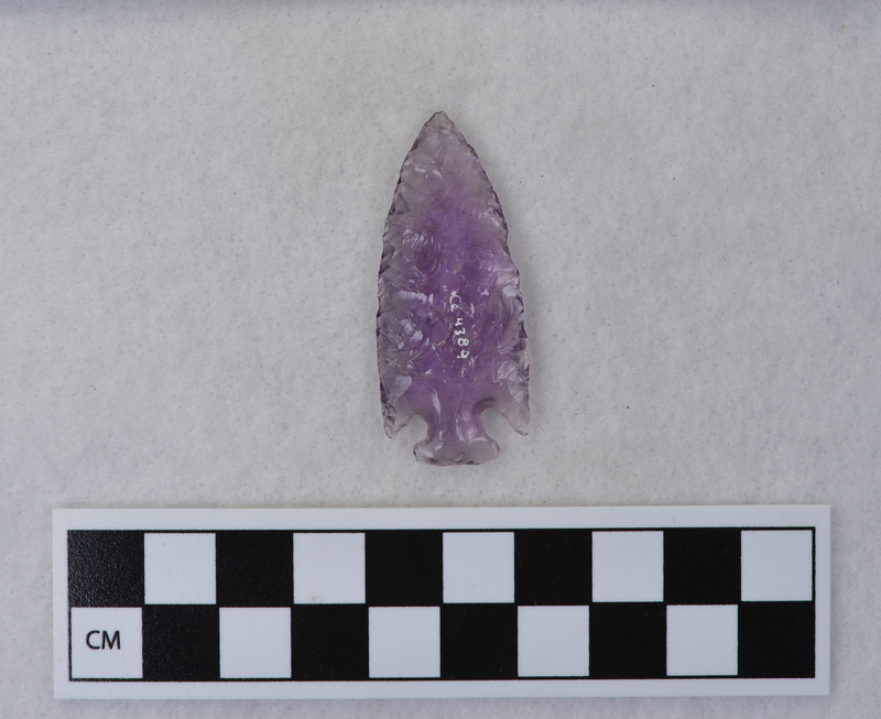 Donald E. Crabtree made this corner notched point from old amythest glass.