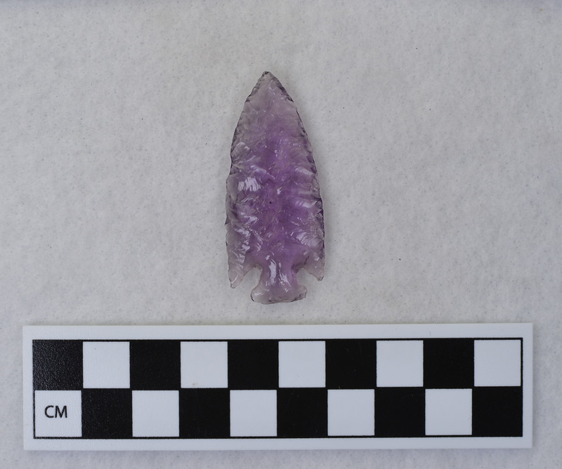 Donald E. Crabtree made this corner notched point from old amythest glass.