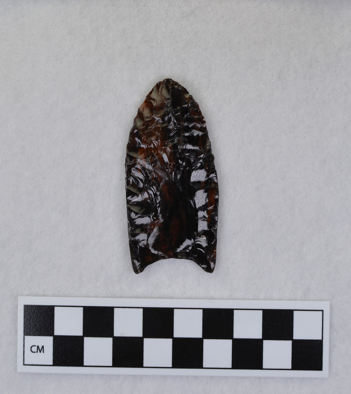 A complete Clovis point created as part of Donald E. Crabtree's Clovis experiments. This object shows that the basal edges and the base of the object were ground.