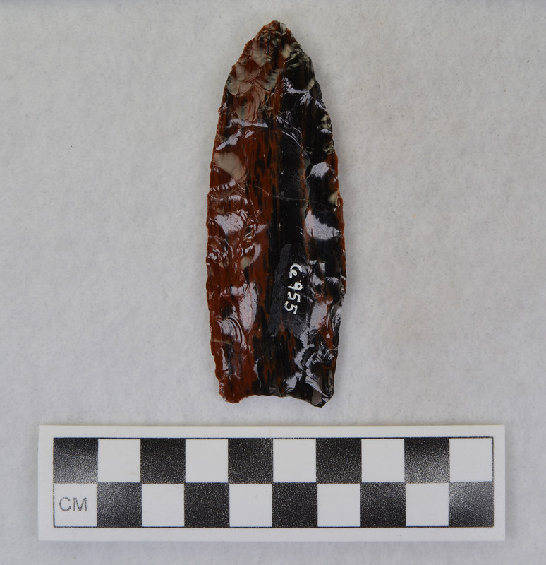 Clovis, glued Fractured when channel flake dove into the point. (JW)