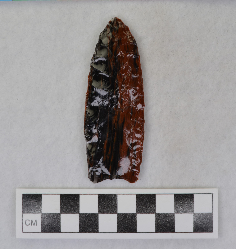 Clovis, glued Fractured when channel flake dove into the point. (JW)