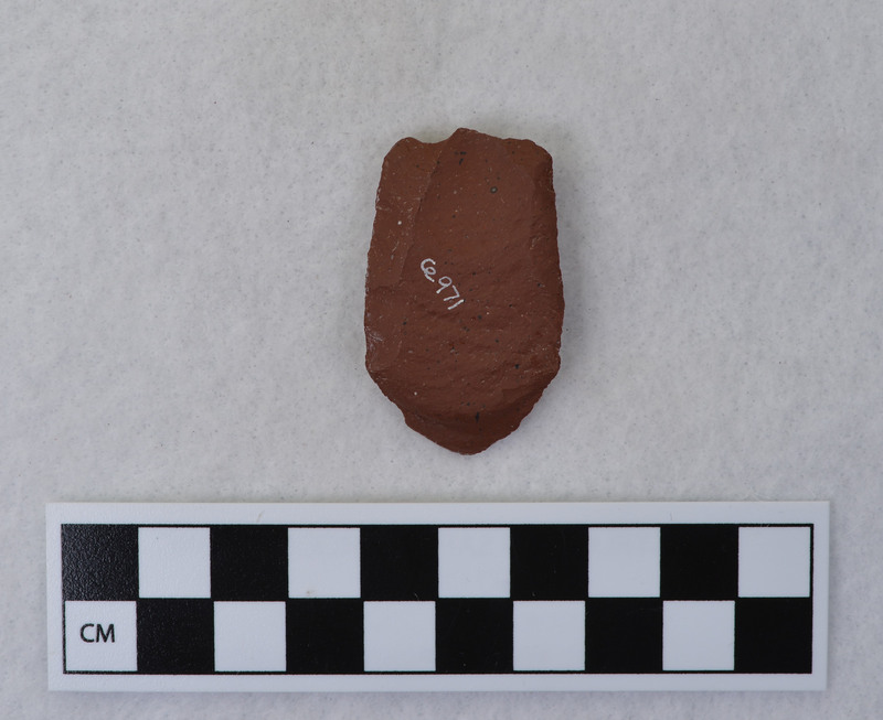 Fluting experiment on Folsom done by Donald E. Crabtree, during his fluting experiments. One channel flake removed that removed a portion of distal end of point. The method of channel flake removal was not noted, but appears to be direct percussion with tip supported by anvil. (GT) More information can be found in CE_B32_F9, F10, CE_B33_F6 and CE_B33_F8-Item1