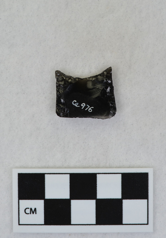 Folsom point base, ground margins