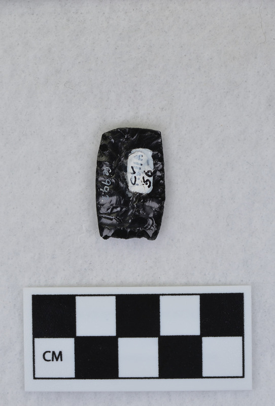 Folsom, distal end removed w/channel flake. Probably hand held to flute. (GT)Distal end is Ce.993, flake pieces are Ce.994. (EL)See Crabtree notes for FVIIA - #56.