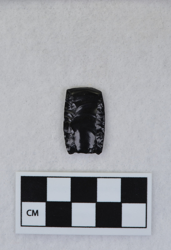 Folsom, distal end removed w/channel flake. Probably hand held to flute. (GT)Distal end is Ce.993, flake pieces are Ce.994. (EL)See Crabtree notes for FVIIA - #56.