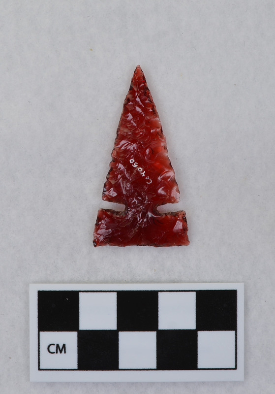 Side notched Material from tail light lens. (JW)