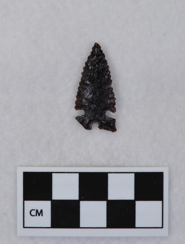 Side notched, serrated, one corner damaged