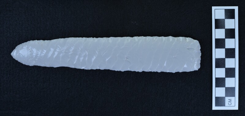 Large, grey/white, glass biface with parallel diagonal flaked, one face not completed