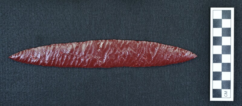 Large, opaque red glass, biface. Created using the Titmus on one side, Crabtree technique on other. Crabtree technique is shown on this side