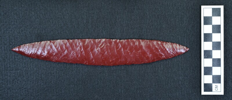 Large, opaque red glass, biface. Created using the Titmus on one side, Crabtree technique on other. Crabtree technique is shown on this side