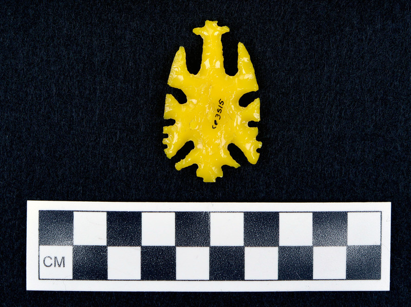 Notched, early ecentric yellow glass