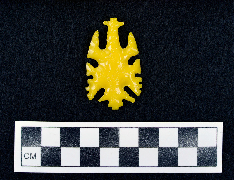 Notched, early ecentric yellow glass