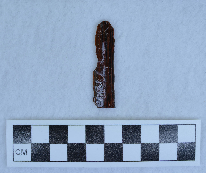 Unifacially flaked prismatic blade section.