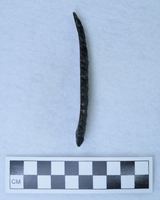 Blade flaked on dorsal face.