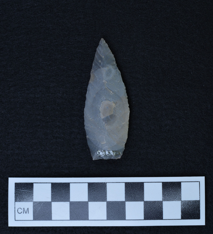 Chevron flaking one face, parallel diagonal other