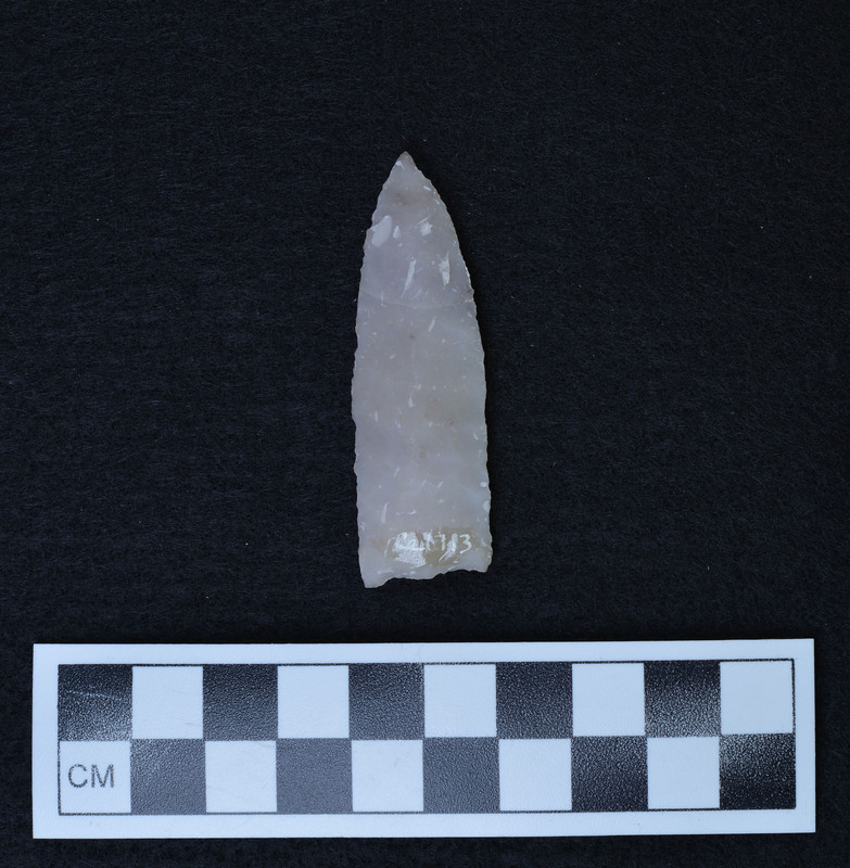 Heat treated, parallel flaking to midline