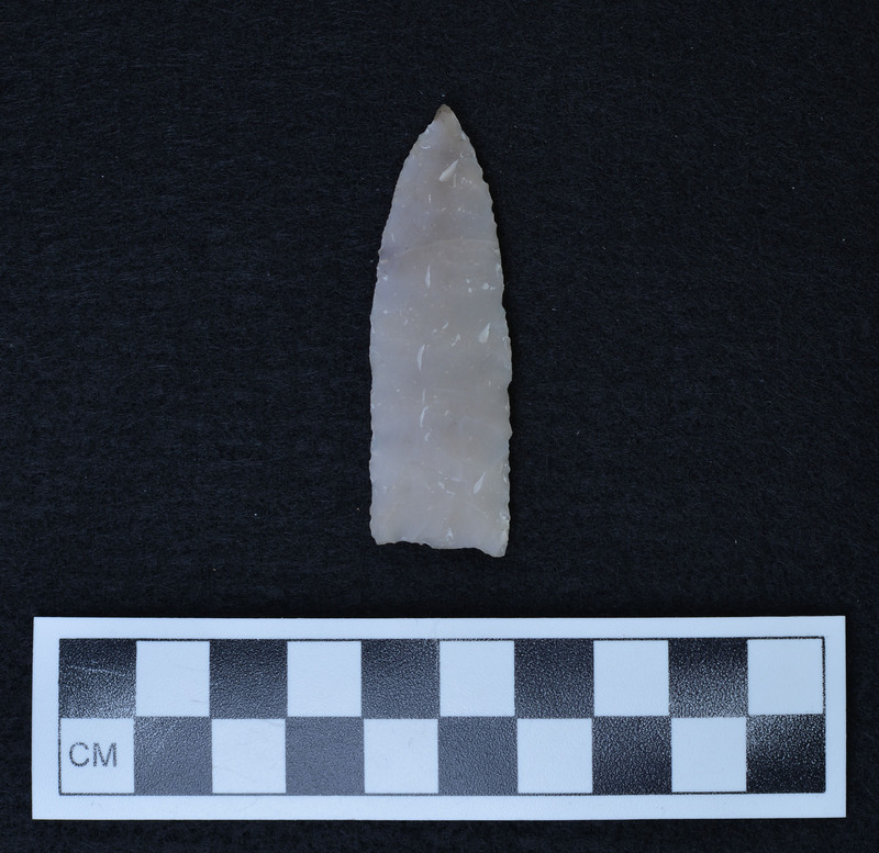 Heat treated, parallel flaking to midline