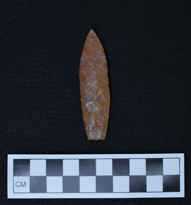 Arco chalcedony projectile point made and signed by Donald E. Crabtree. The signature can be seen on this side of the object, approximately 1/4" from the proximal end (the base).