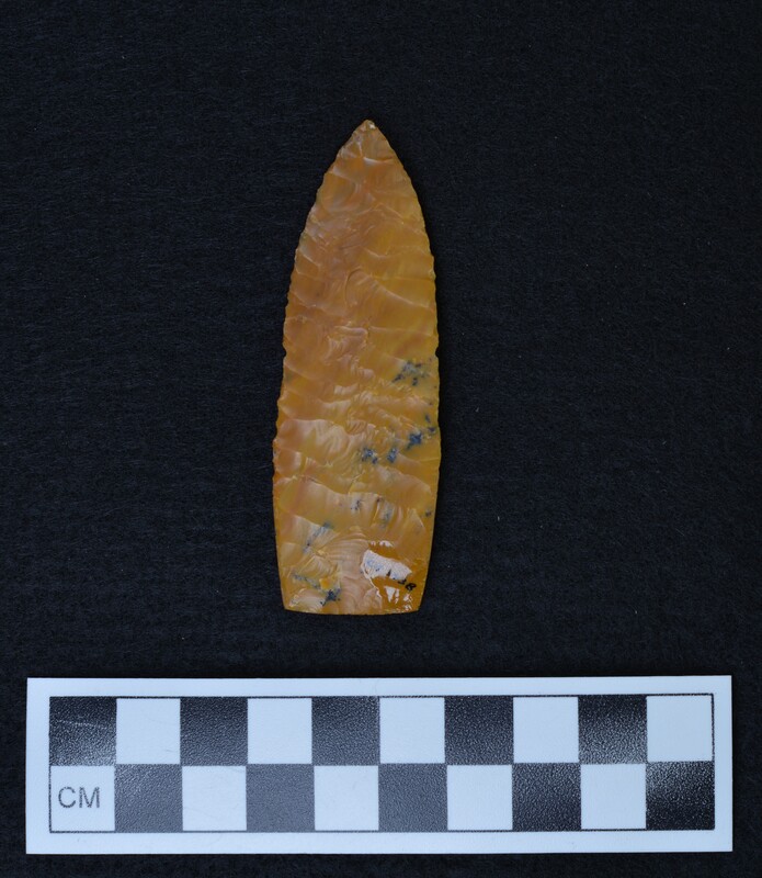 A Scottsbluff style point made by Donald E. Crabtree circa 1965. The biface exhibits heavily ground basal margins.