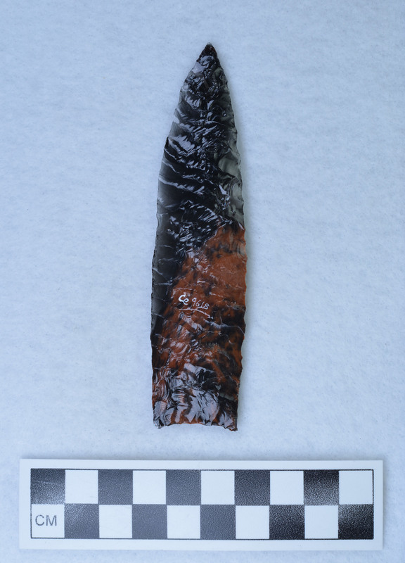 A lanceolate (Angostum) style point with parallel diagonal flaking. Created and signed by Donald E. Crabtree.