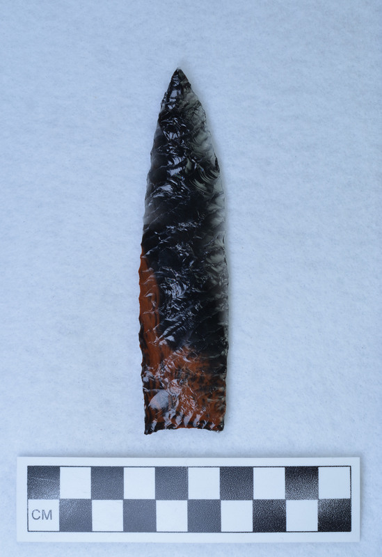 A lanceolate (Angostum) style point with parallel diagonal flaking. Created and signed by Donald E. Crabtree.