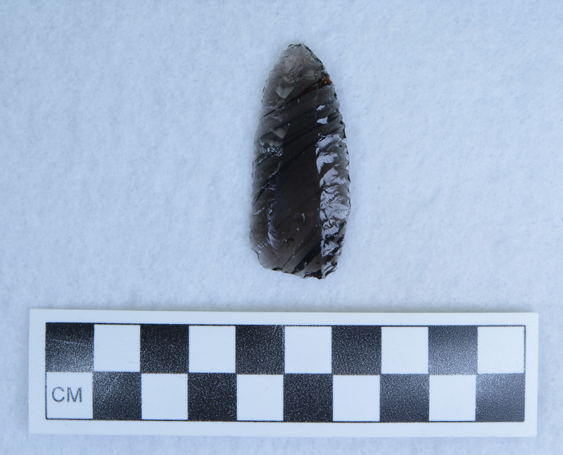 Titmus technique, What appears to be a channel flake actually originated at the distal end. This point was probably made on a blade with a portion of the original blade scar showing. (JW)
