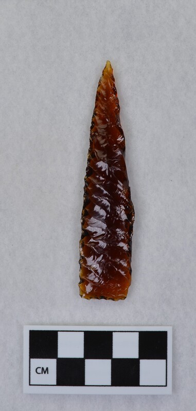 Brown glass (Clorox bottle base) exhibiting a perverse fracture on the margin that occurred during parallel diagonal flaking by Donald E. Crabtree