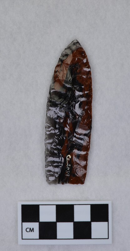 Collateral flaking, lanceolate style, basal margin lightly ground, base thinned